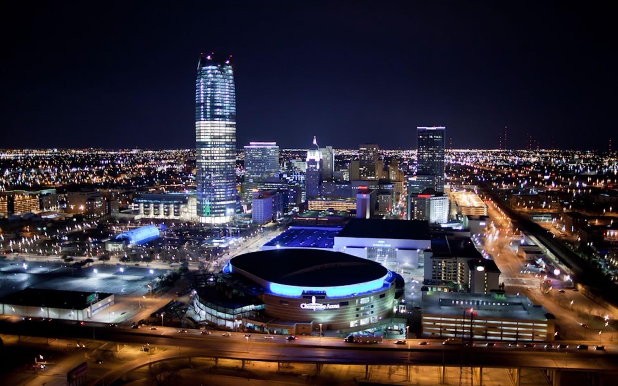 Aerial view of downtown Oklahoma City and its highways at night.